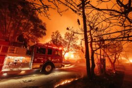 Palisades resident evacuate the area during the Palisades Fire on 7 January 2025.