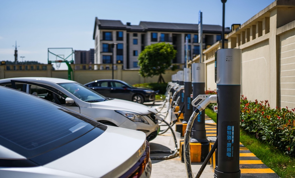 New energy vehicles being charged at a charging area in China's Guizhou Province.